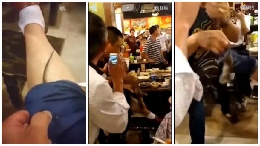 重慶一名男子到火鍋店用餐，一隻老鼠鑽進他褲襠，讓他當場驚嚇萬分。(圖／翻攝自YouTube)