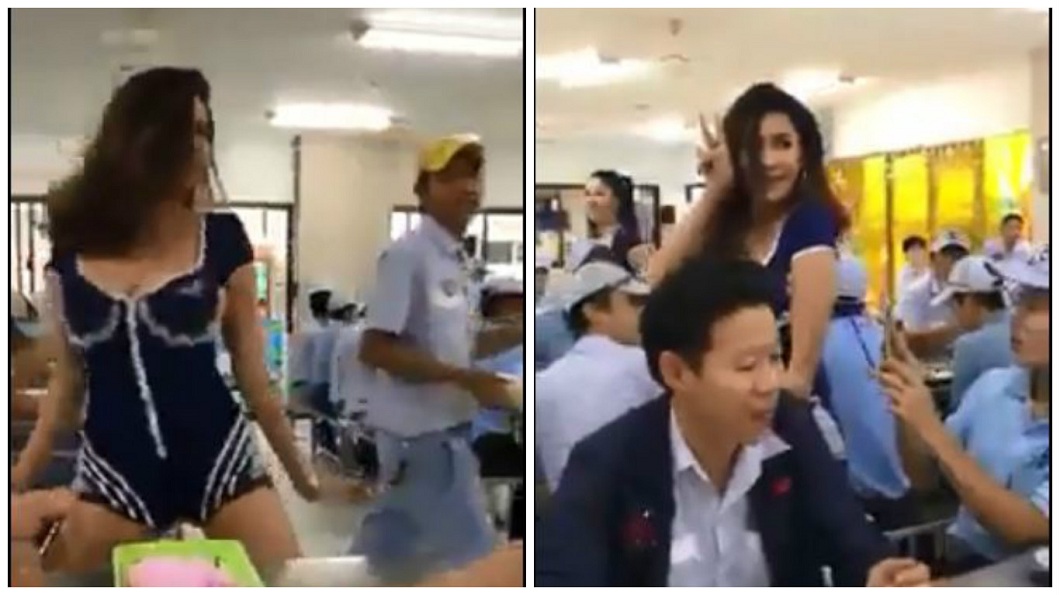 泰國一間公司在午餐時間找來辣妹熱舞，現場男員工嗨翻，還有人拿起手機拍攝。(圖／翻攝自臉書粉絲團)