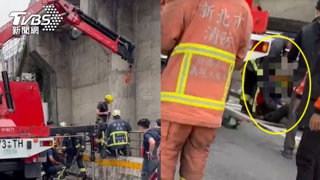 消防人員以吊掛的方式將男子從水溝中吊起。（圖／TVBS）