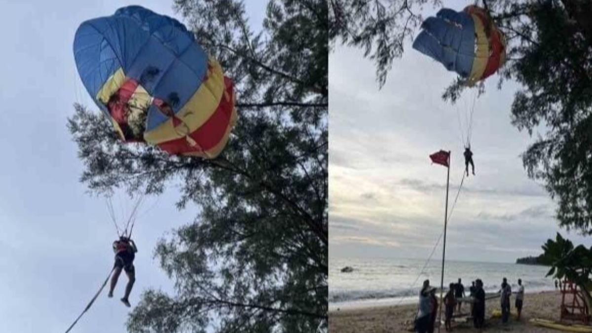 遊客普吉島玩海上拖曳傘出意外，卡5公尺高樹上搖搖欲墜。（圖／翻攝自《The Thaiger》）