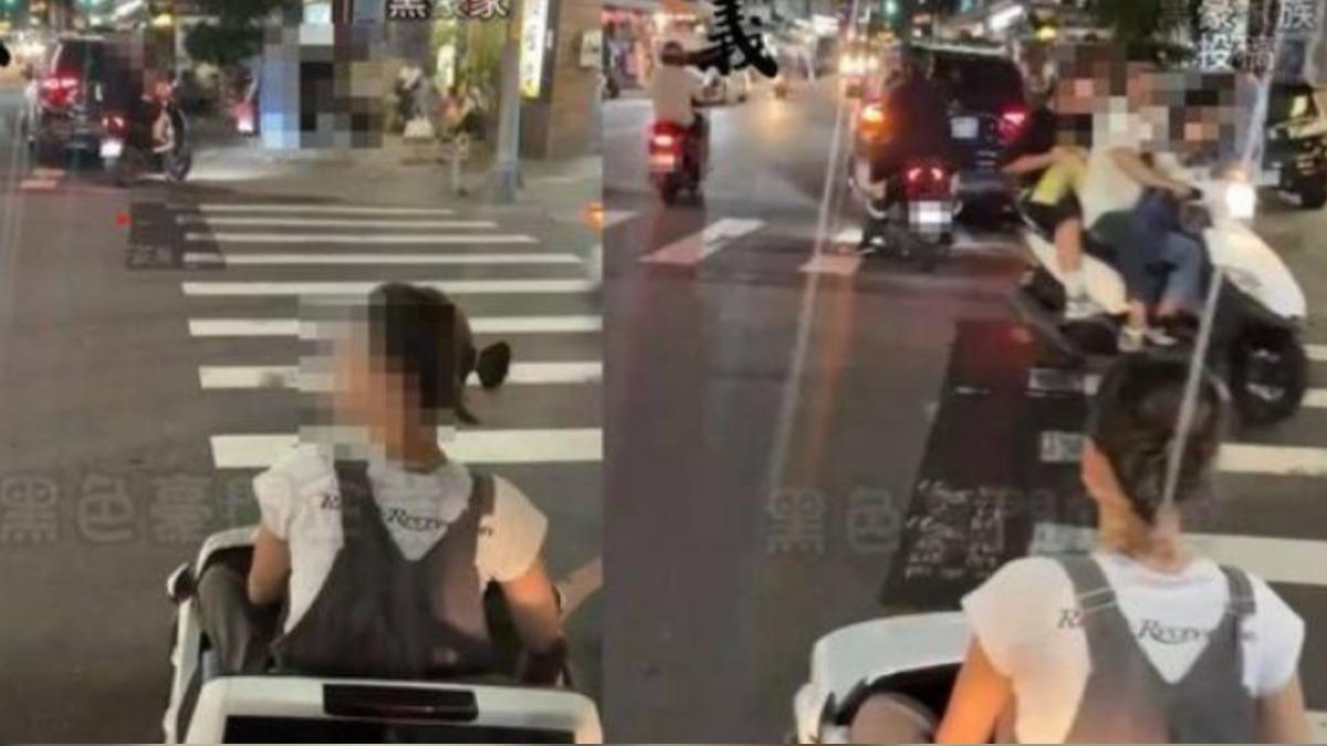 扯！三重一名女子開電動玩具車過馬路。（翻攝黑色豪門企業）