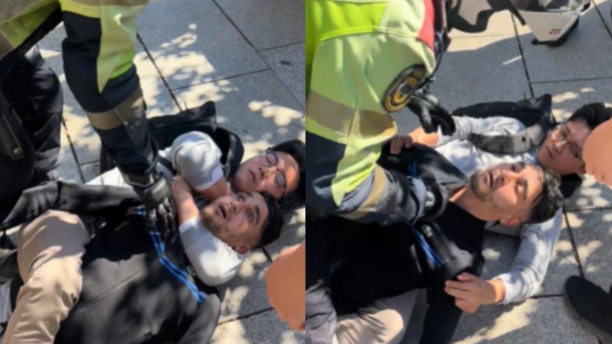 陸籍攝影師（背包者）直接將搶匪（黑衣者）霸氣鎖喉，直到警方來才鬆手。（圖／翻攝自 X@Ma_WuKong）