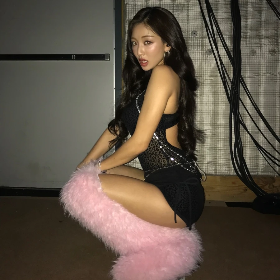 Photo shared by JIHYO on October 16, 2025 tagging @victoriassecret, and @vspink. May be an image of costume, fishnet stockings and text.
