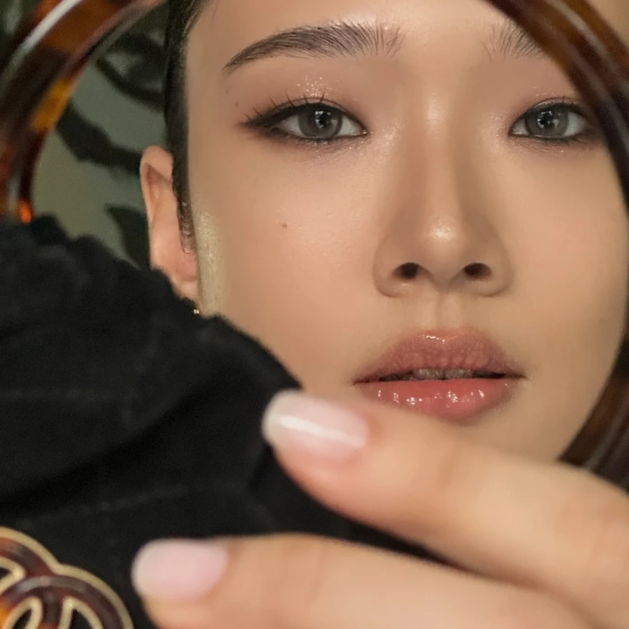 Photo shared by Newtron Whangvisarn on November 05, 2025 tagging @aokbab. May be a closeup of one or more people, makeup, lipstick, mirror and text.